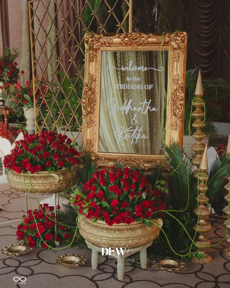 Luxury wedding welcome signage with red roses